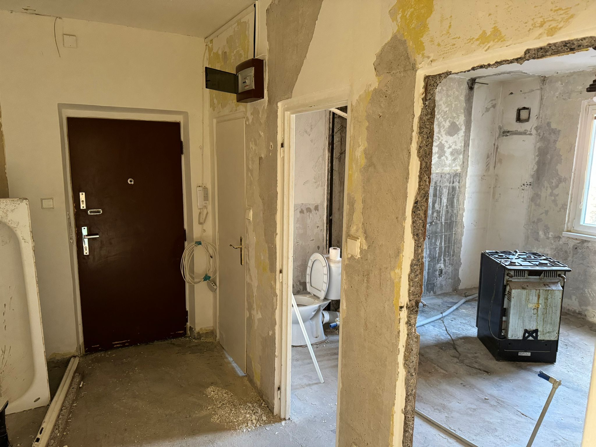 a bathroom with a toilet, sink, and bathtub